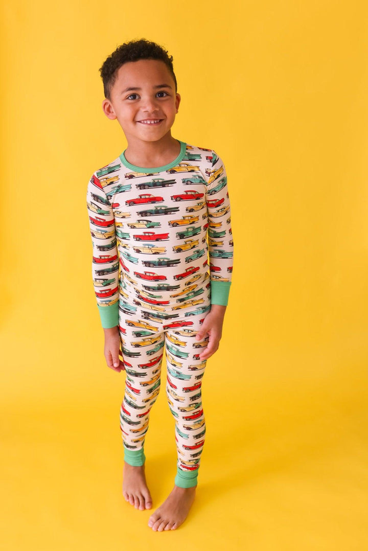 Full view of toddler boy modeling classic cars two-piece bamboo pajamas — cozy, hypoallergenic sleepwear perfect for boys who love cars.