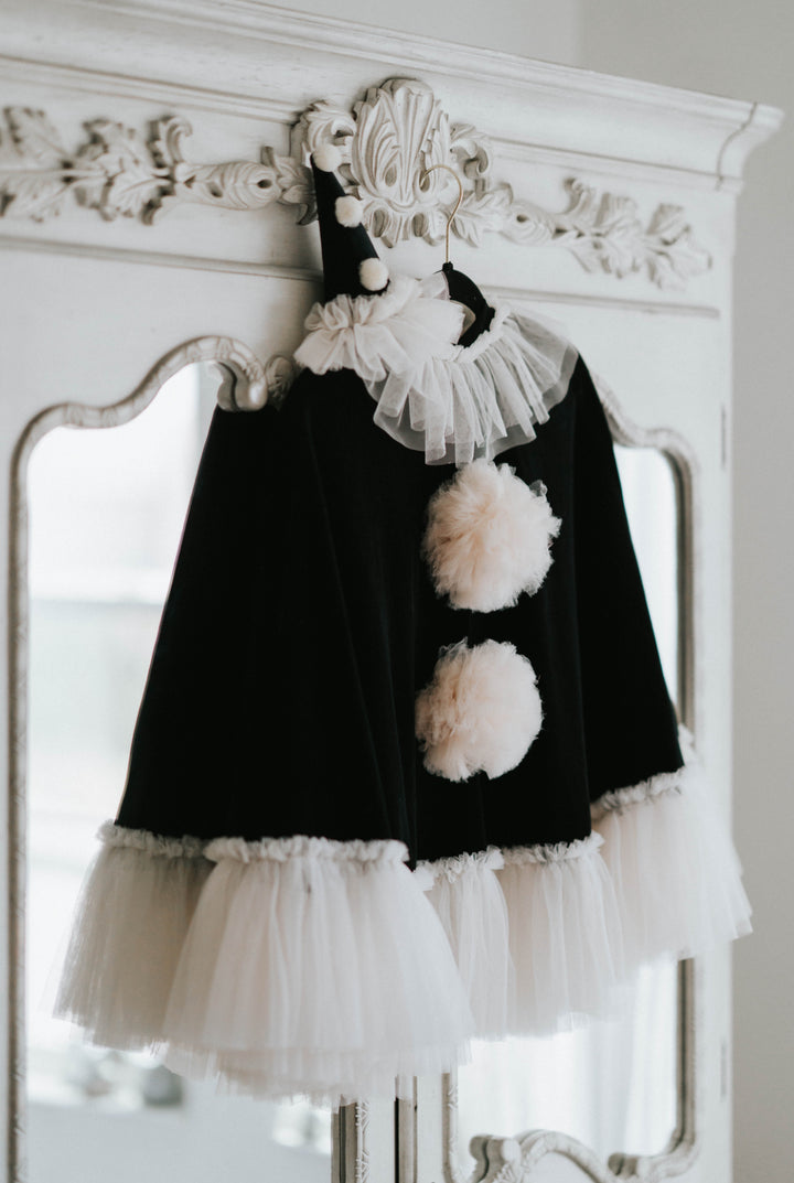 Kids Halloween clown costume with velvet cape and ruffled collar on hanger