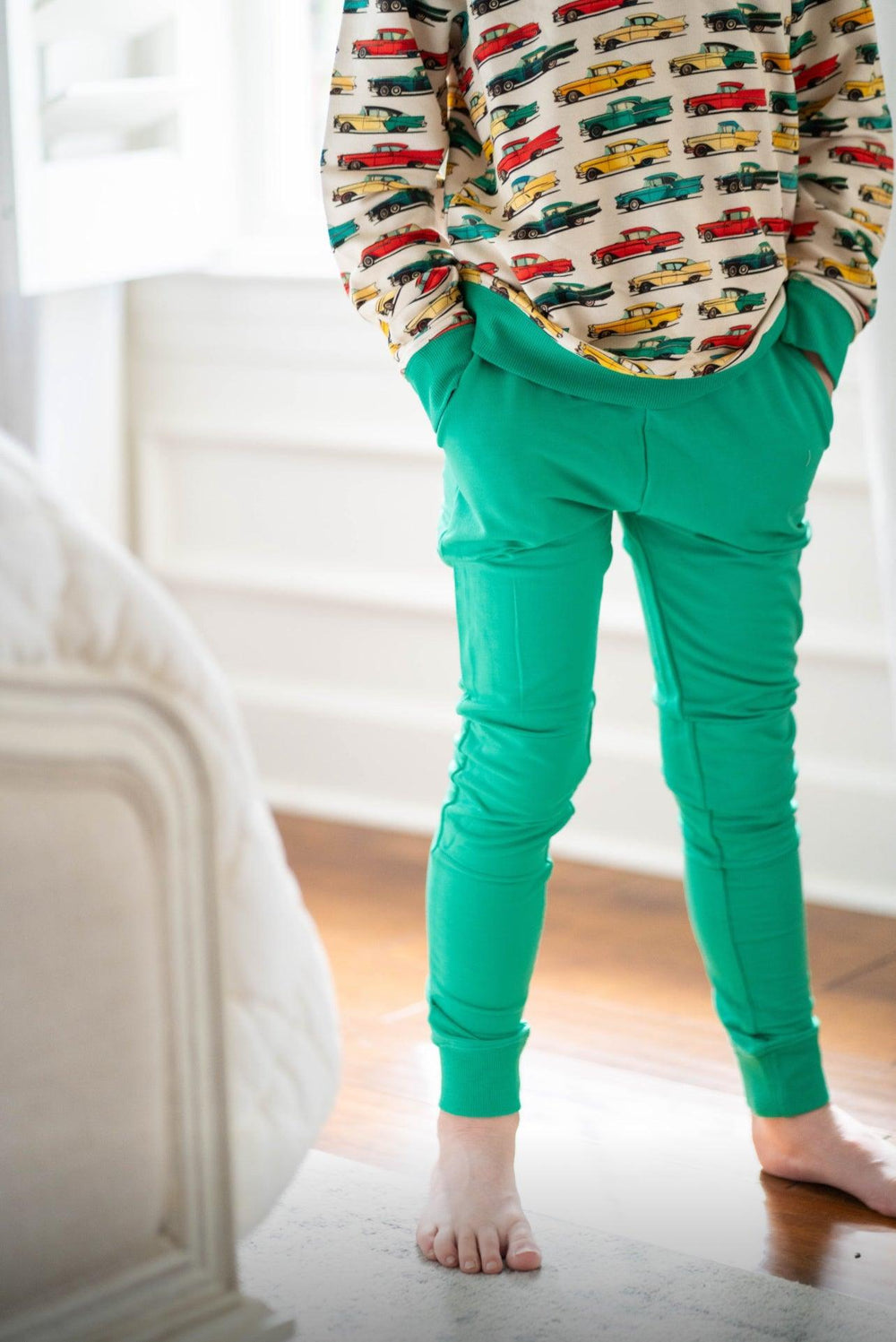 Little boy wearing lagoon green unisex French terry joggers paired with classic cars French terry sweatshirt, toddler casual outfit for boys