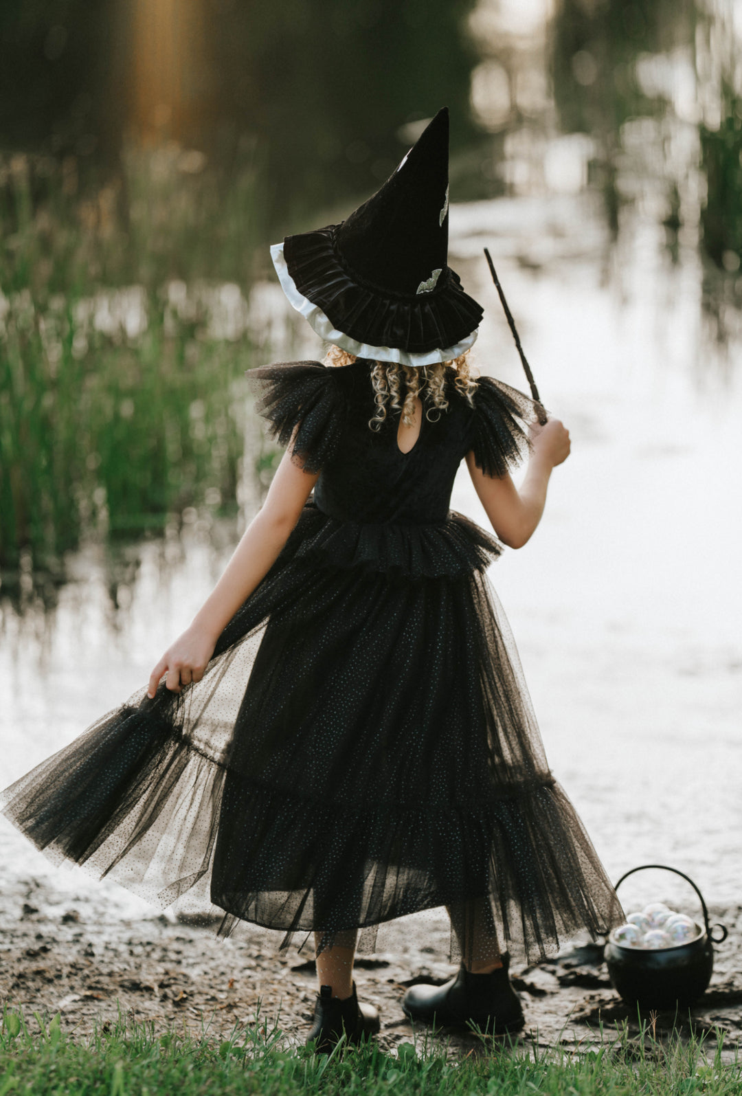 Back view of sparkly black tulle witch dress for girls Halloween costume