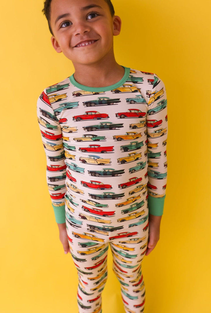 Close-up of classic cars bamboo pajamas on toddler boy, showing vibrant vintage car print and ultra-soft bamboo fabric texture.