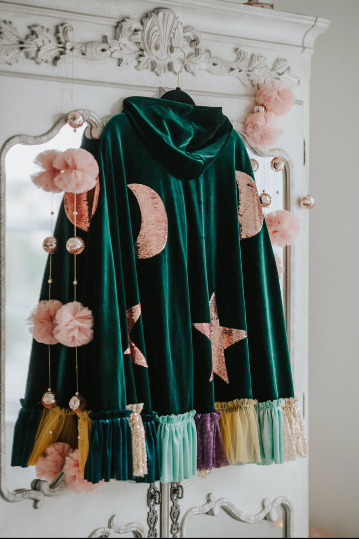 Flat lay back view of heirloom velvet green hocus pocus winifred sanderson witch cape with celestial embellishments.