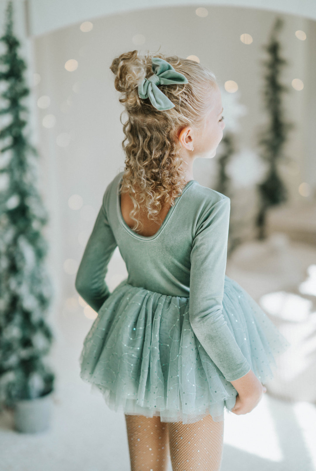Back view of Willow tutu dress with scoop neckline and layered tulle skirt.