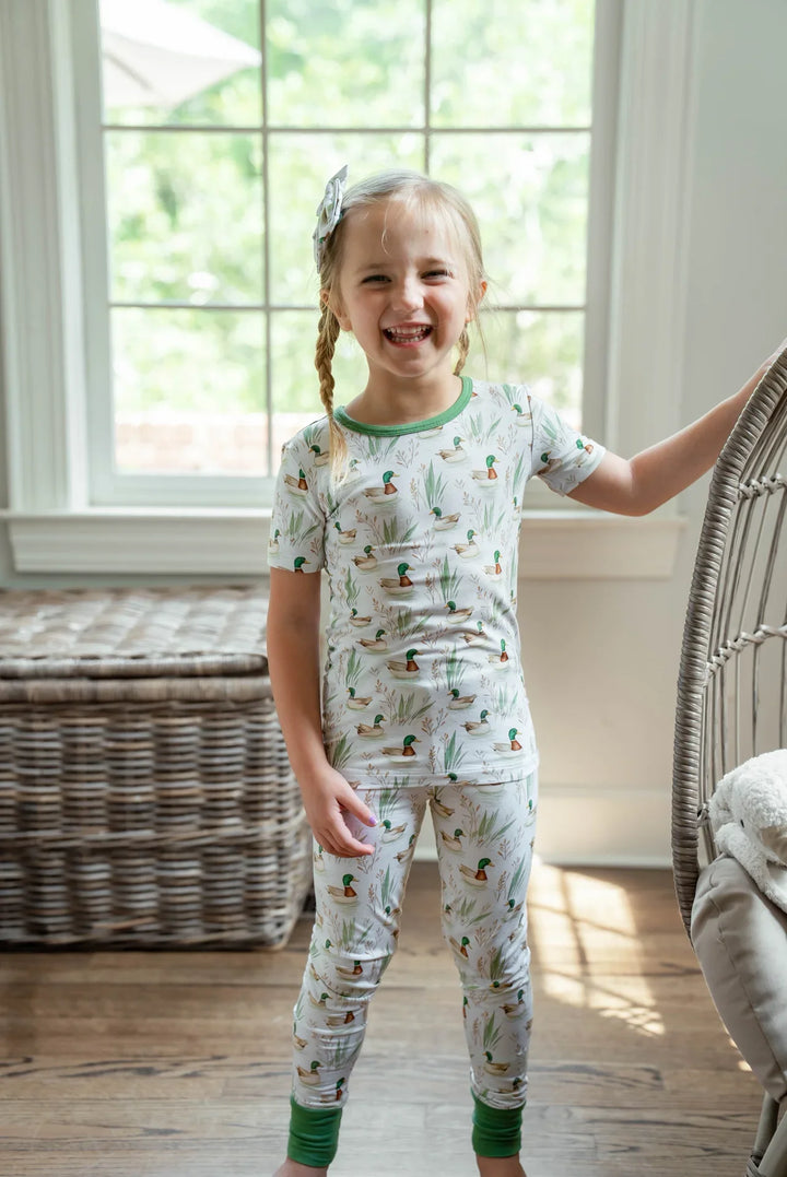 Little girl standing in mallard duck two-piece bamboo pajamas, cozy and soft for bedtime or lounging.