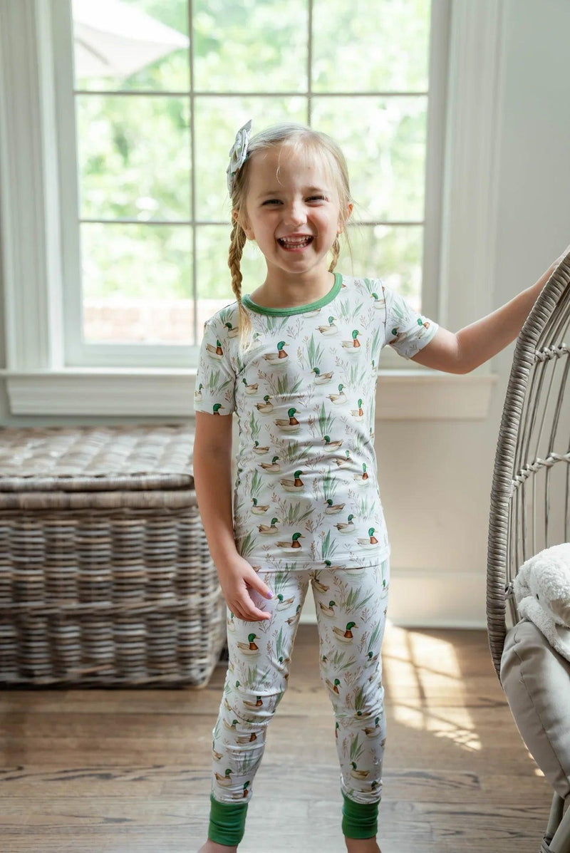 Little girl standing in mallard duck two-piece bamboo pajamas, cozy and soft for bedtime or lounging.