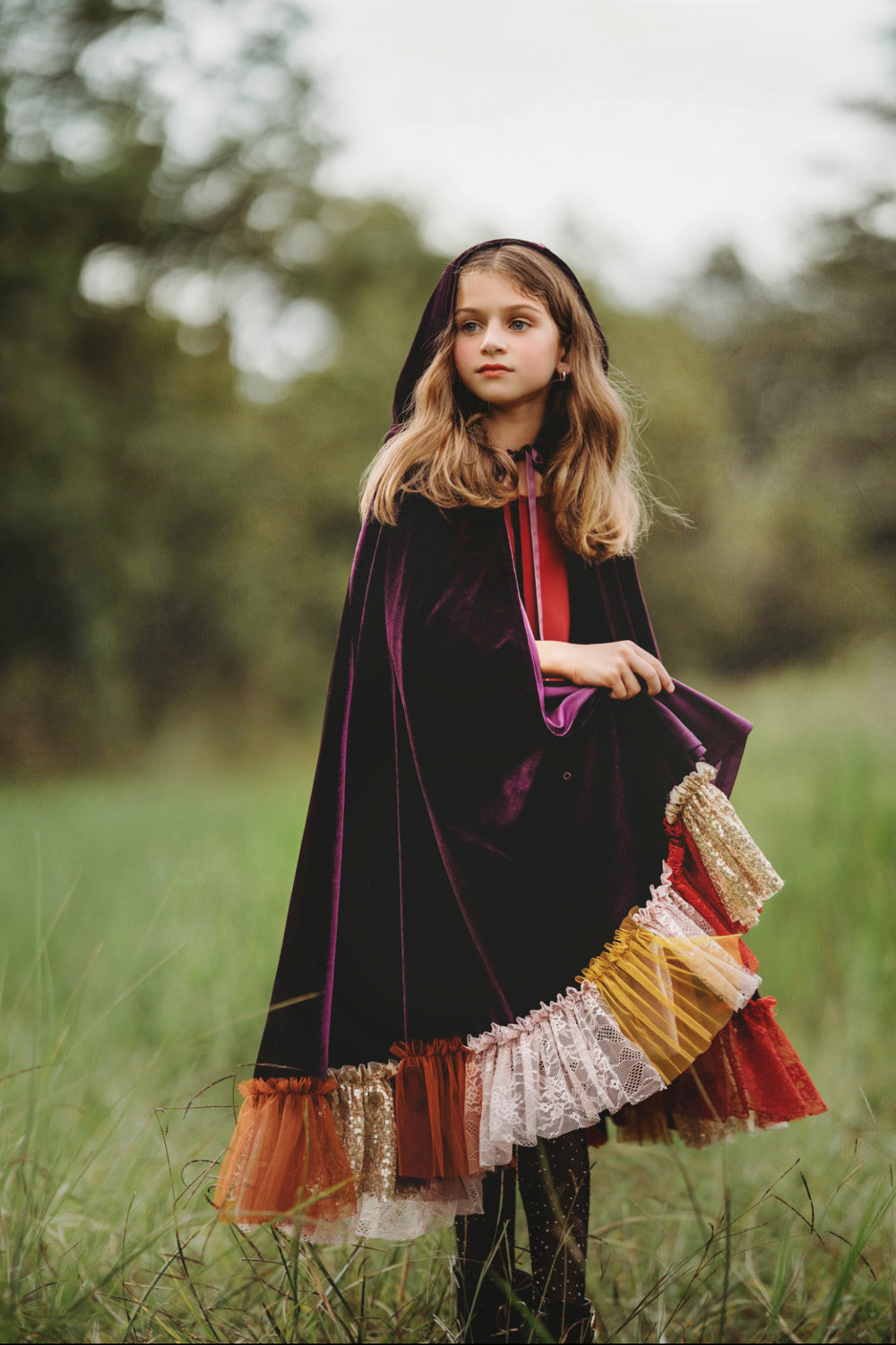 Girl wearing purple velvet witch cape with embroidered trim – Sarah Sanderson hocus pocus costume