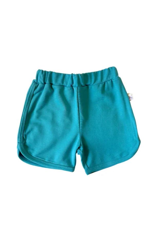 Unisex kids shorts in aqua blue French terry fabric, featuring soft stretch waistband and relaxed summer fit.
