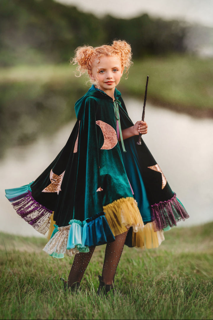 Child front-facing in green hocus pocus witch costume cape, toddler size. Winifred Sanderson
