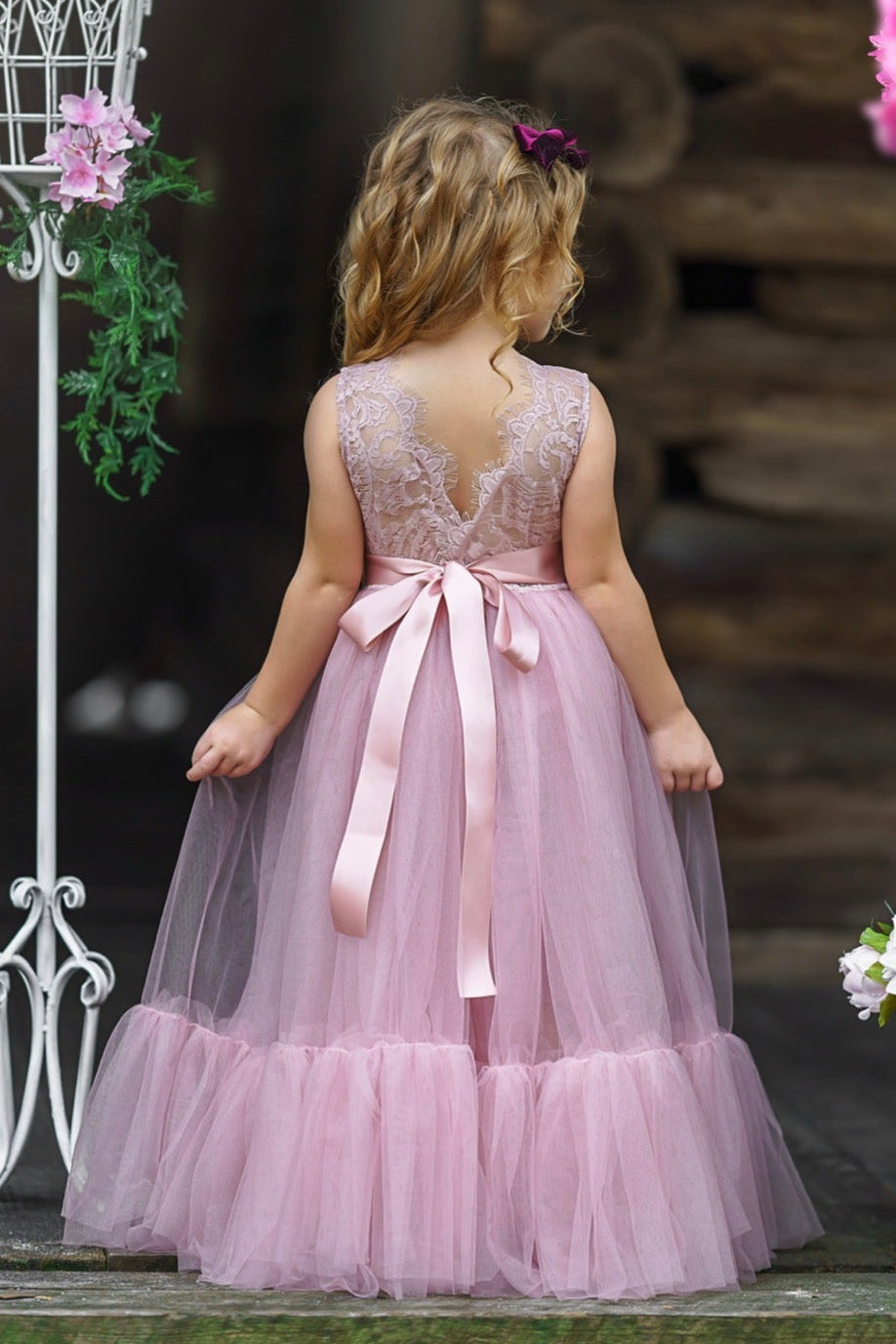 Back view of mauve flower girl dress showing eyelash lace V-back and soft tulle skirt