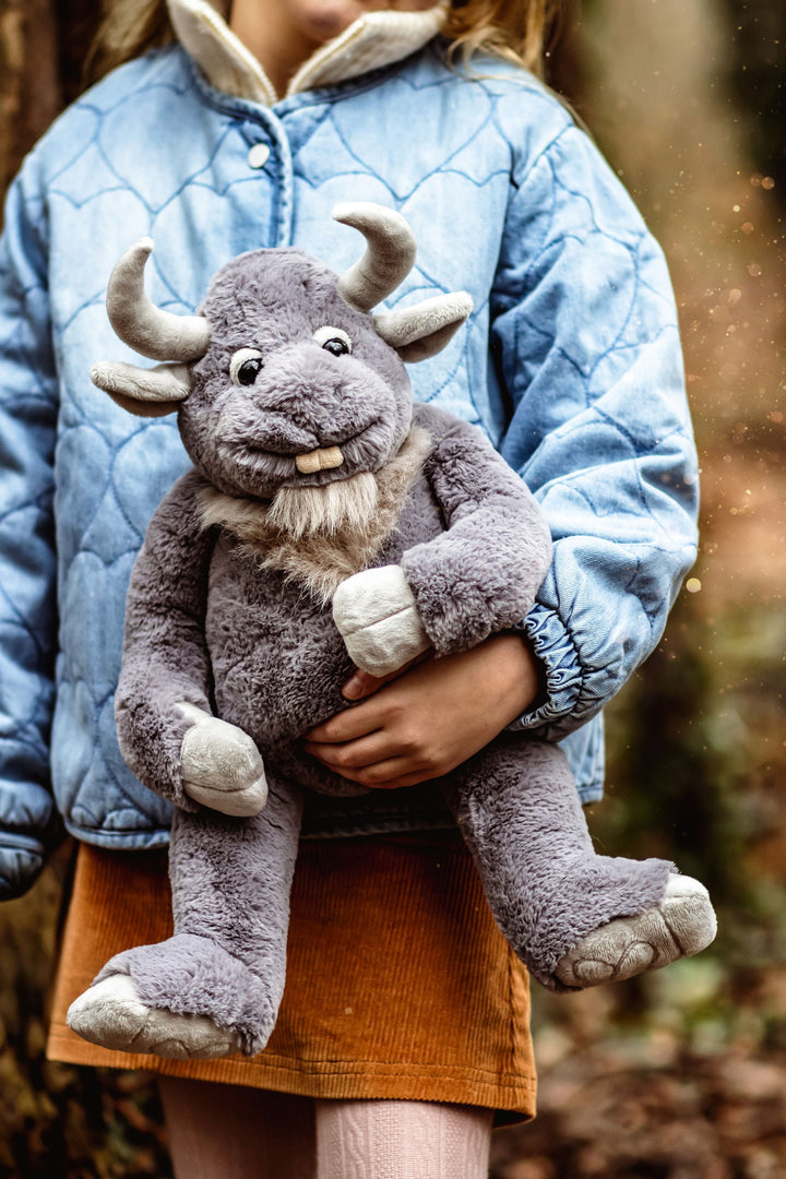 Cobblestone giant plush lifestyle photo held by child outdoors Charlie Bears