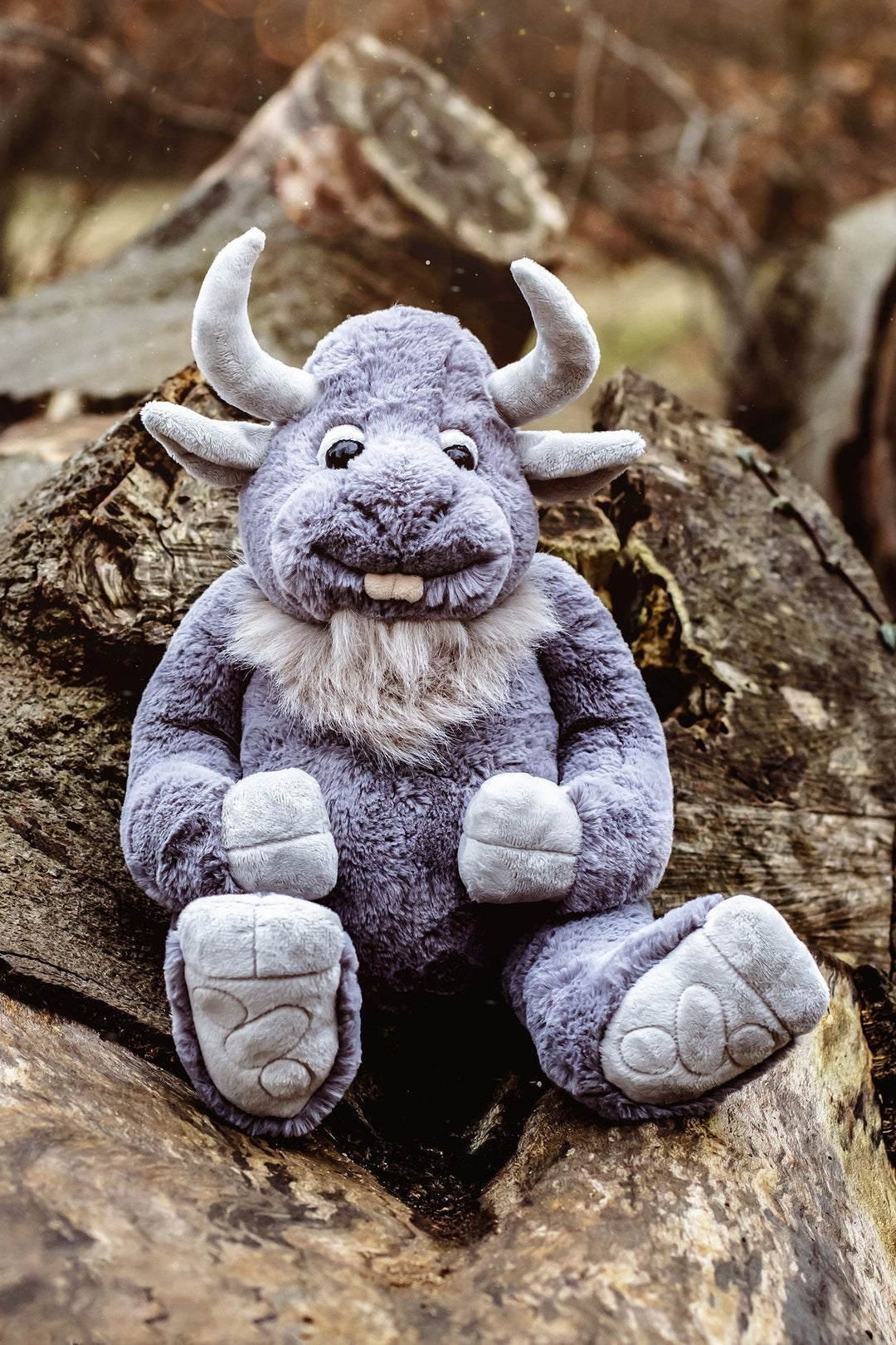 Cobblestone giant plush grey monster teddy sitting on rocks outdoors Charlie Bears