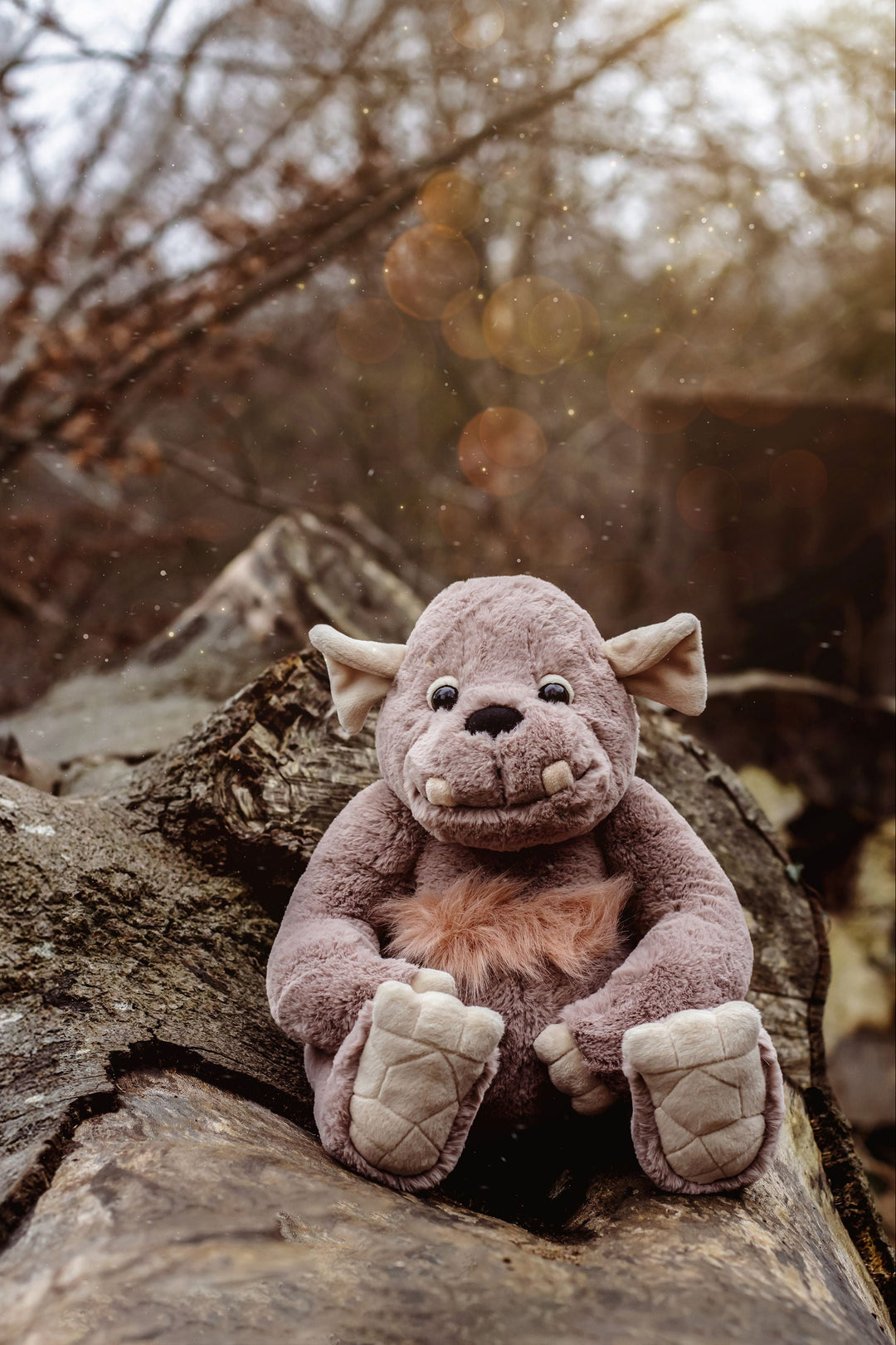 Boulder giant plush side profile with soft toothy grin