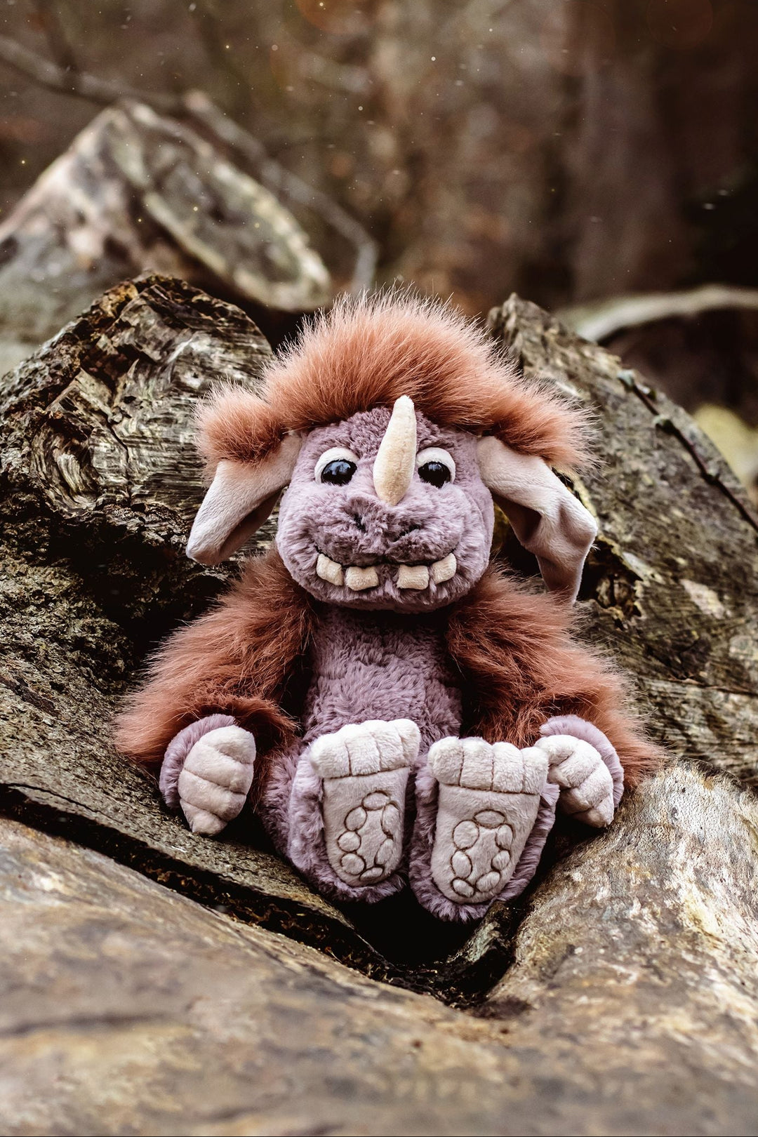 Pebble ogre plush toy lifestyle photo held in arms soft fantasy creature plush for kids