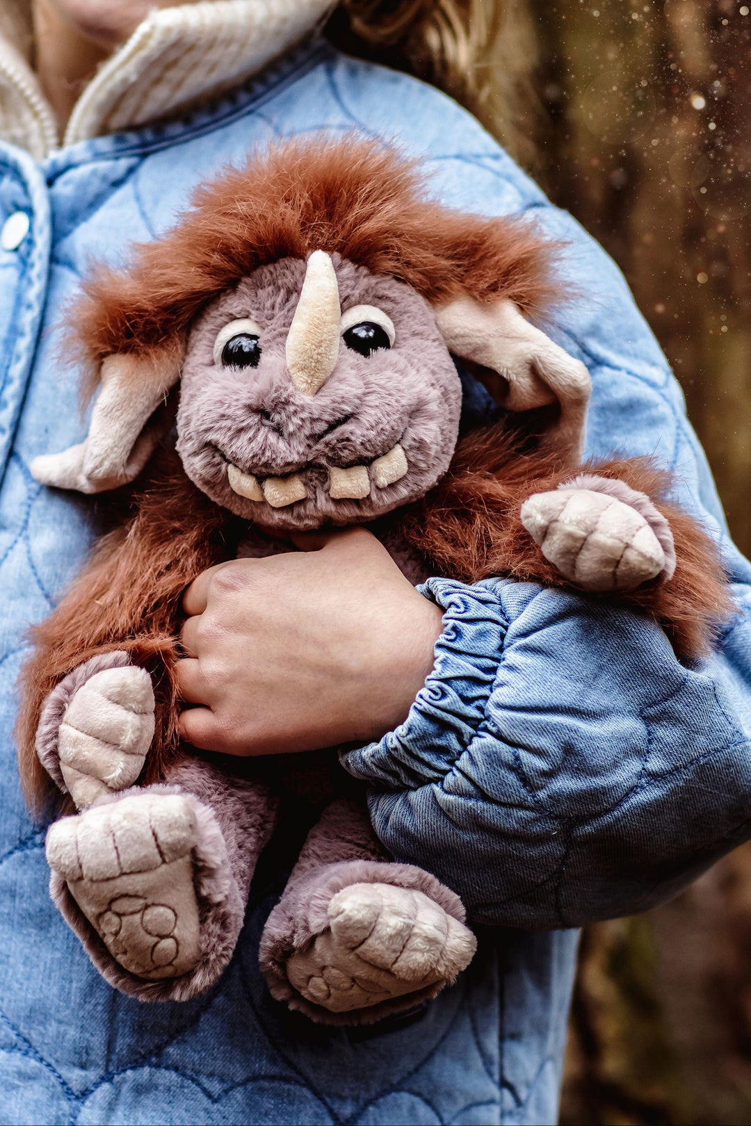 Pebble ogre plush by Charlie Bears mythical creatures collection held by child outdoors