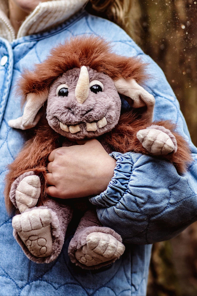 Pebble ogre plush by Charlie Bears mythical creatures collection held by child outdoors