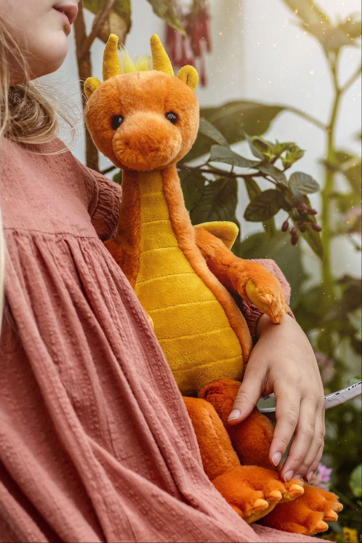 Lifestyle photo (girl holding dragon)
Diamonds the Dragon by Charlie Bears orange plush dragon stuffed animal held by child lifestyle photo