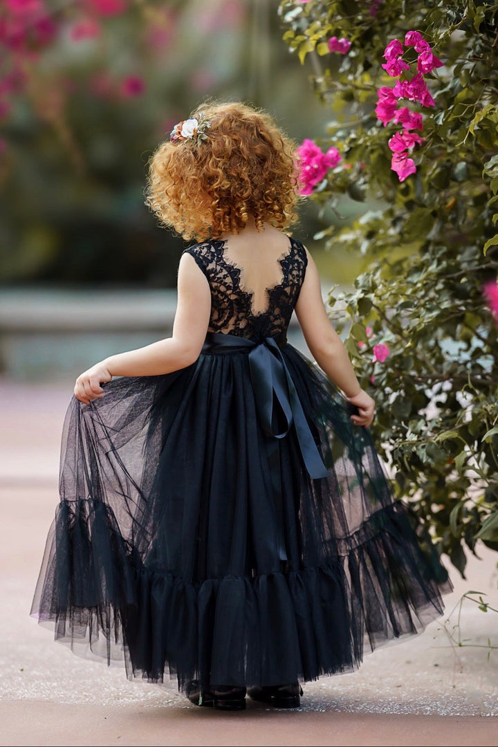 Formal black lace flower girl gown styled for evening ceremony, holiday or wedding.