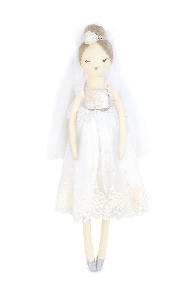 Doll in a white bride dress with a tiara on a white background