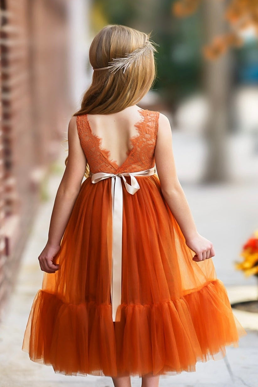 Burnt orange sleeveless lace flower girl dress styled for fall wedding portraits