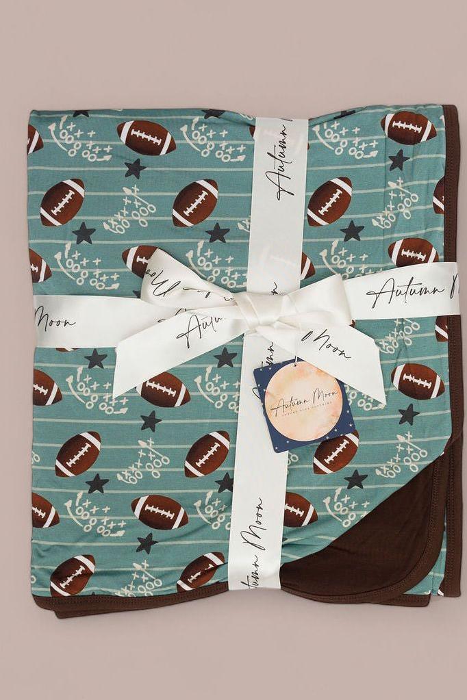 Football Fans bamboo blanket laid flat, showing full football print design