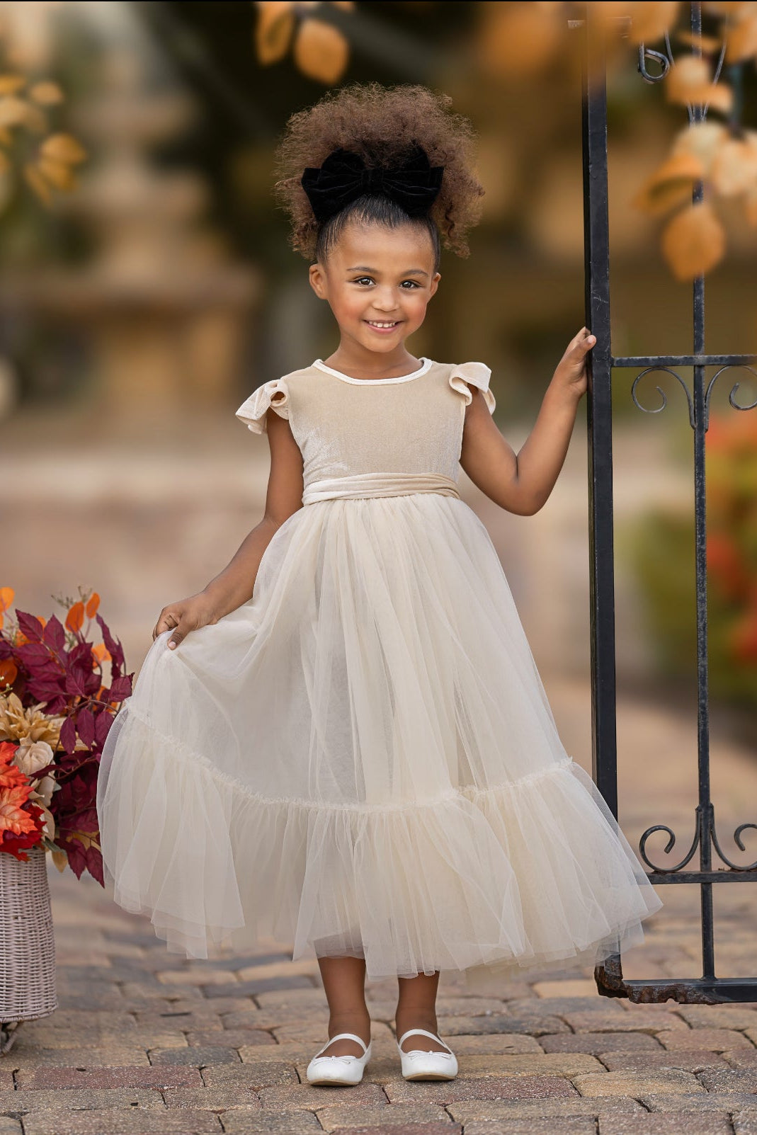 Marcella champagne velvet flower girl dress with ruffle sleeves and soft tulle skirt, front view