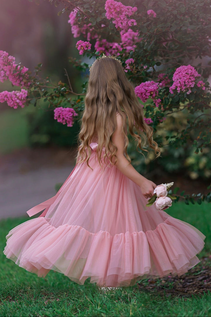 Back view of rose flower girl gown showing eyelash lace V-back and soft tulle layers