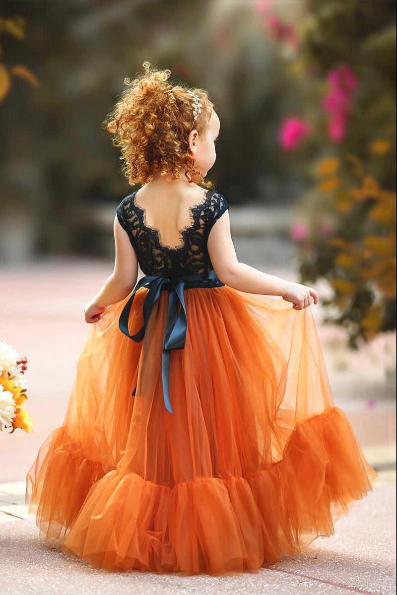 Back view of black lace and burnt orange tulle flower girl dress showing eyelash lace V-back