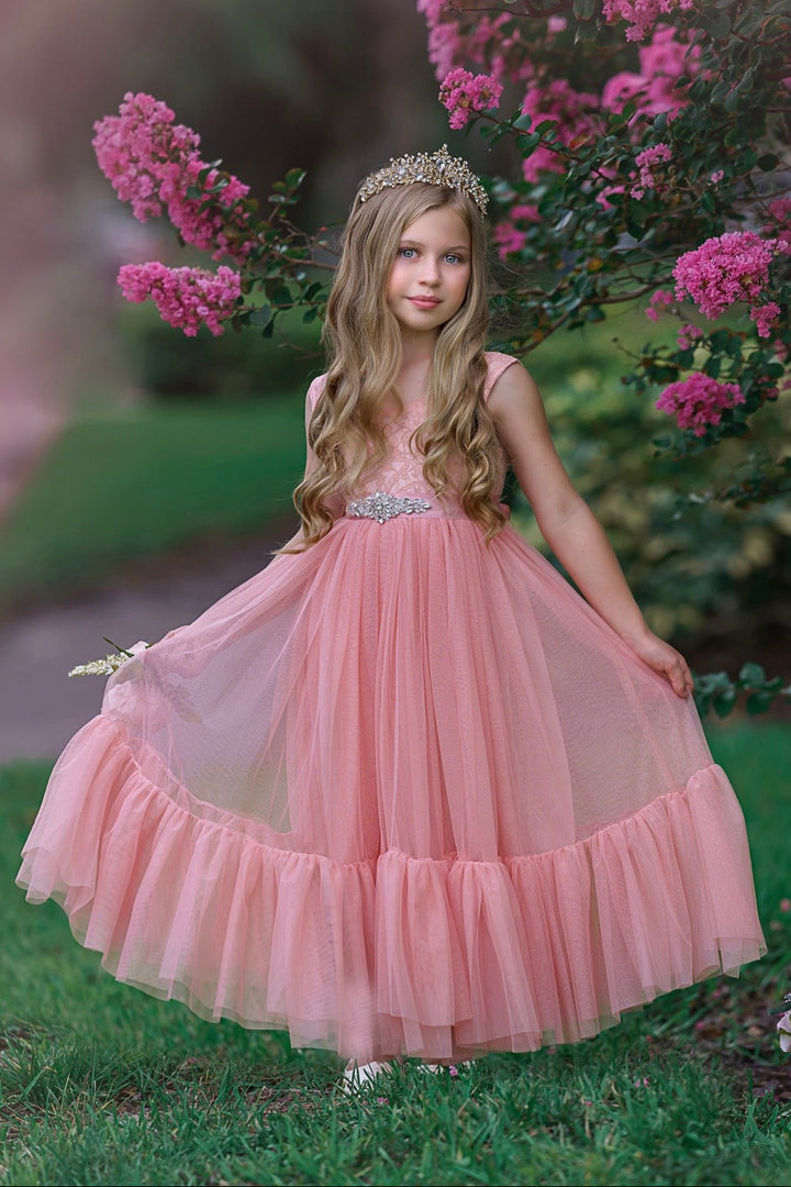 Rose pink lace flower girl dress with V-back and layered tulle skirt photographed outdoors