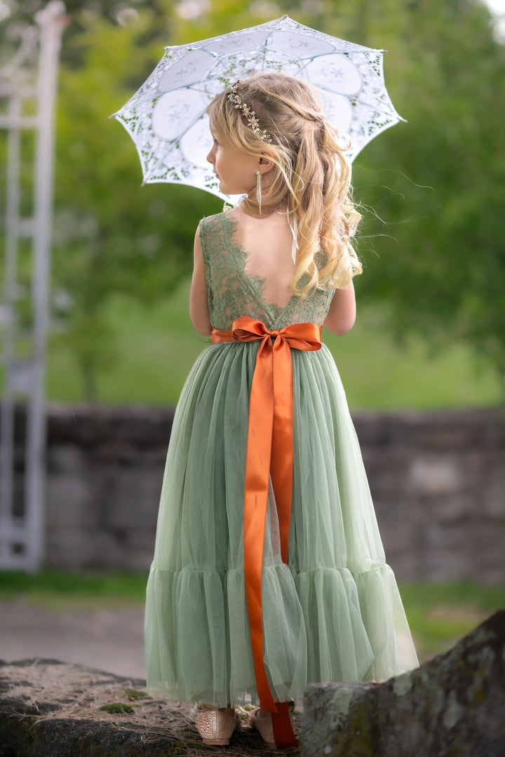 Sage tulle flower girl dress styled for woodland or outdoor ceremony
