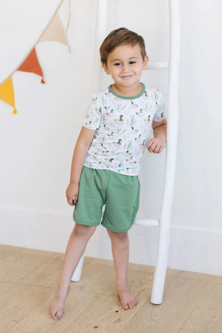 Pine green French terry shorts for toddlers and kids, featuring soft breathable fabric and gender-neutral style.