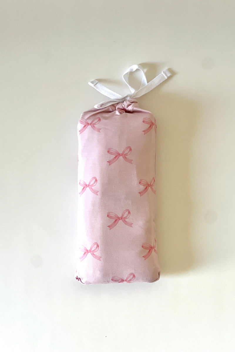 
Pink Bows bamboo swaddle blanket folded inside matching pink bow printed drawstring pouch — perfect for gifting, baby shower bundles, and nursery organization.
