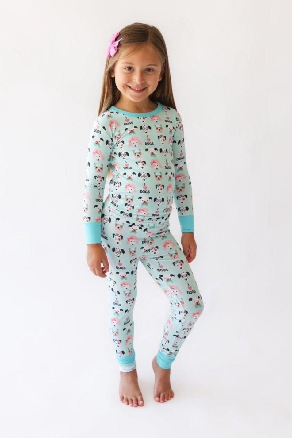 Child wearing I Love Dogs bamboo two-piece pajama set featuring hand-drawn dog print