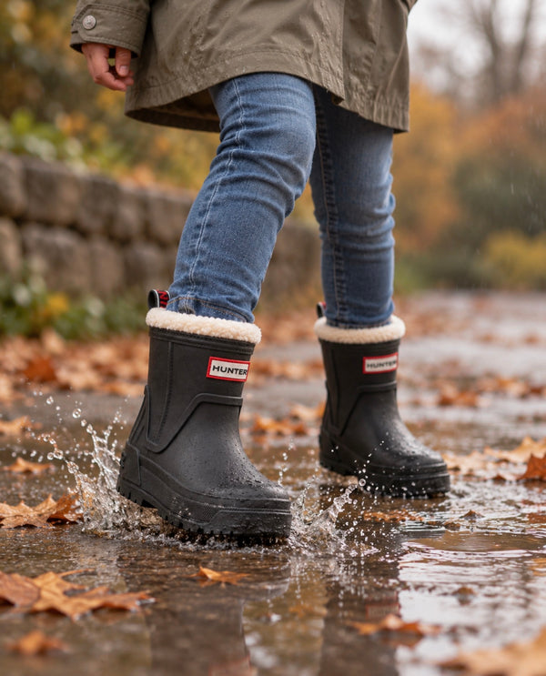 Child wearing black Hunter boots Gracey waterproof rain boots