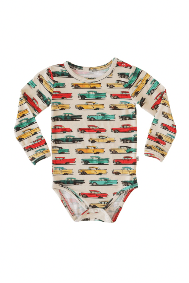 Flat lay of classic cars long sleeve bamboo baby bodysuit with snap bottom, featuring a vintage car print on soft blue fabric — breathable and hypoallergenic.
