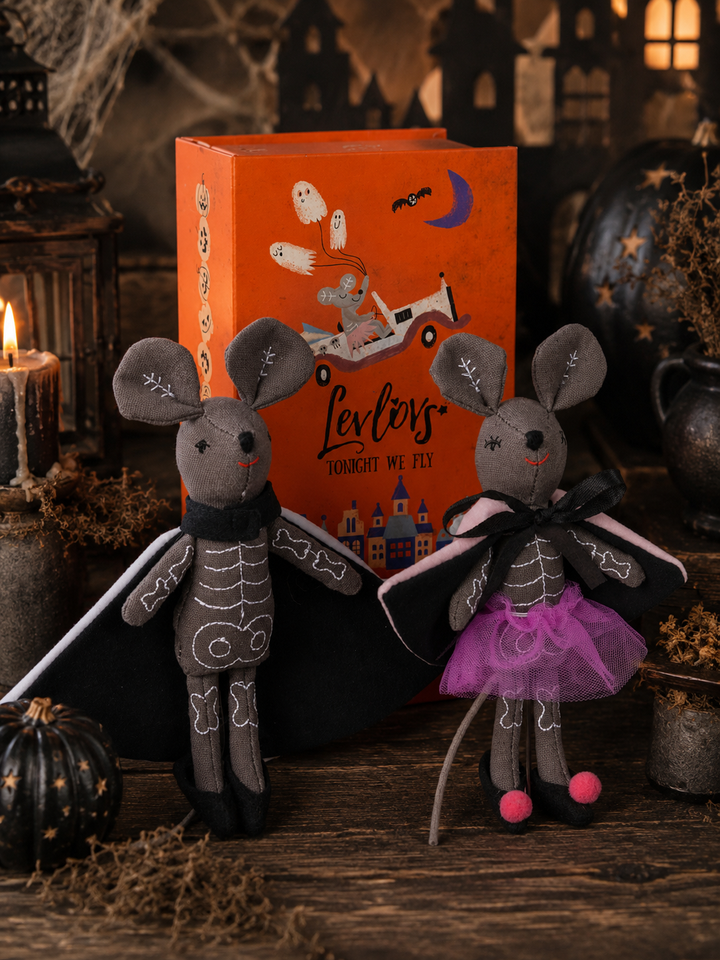 LevLovies “Tonight We Fly” Halloween mice displayed in front of their illustrated storybook keepsake box, featuring two handcrafted skeleton mice wearing black capes, one with a whimsical purple tulle skirt.