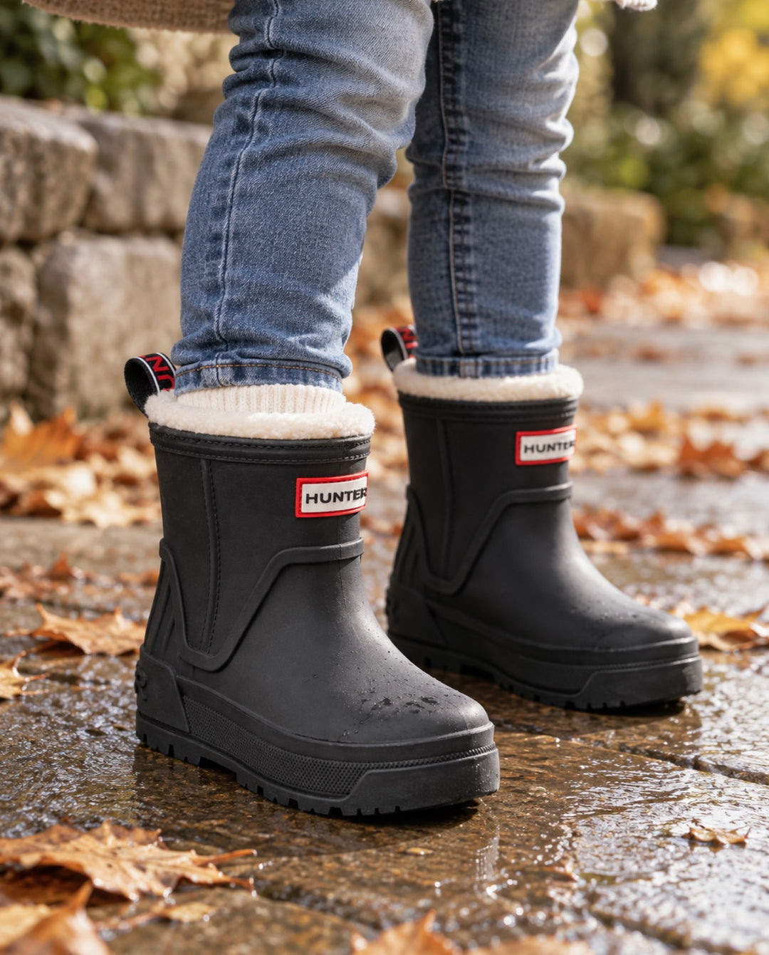 Child wearing black Hunter boots Gracey waterproof rain boots