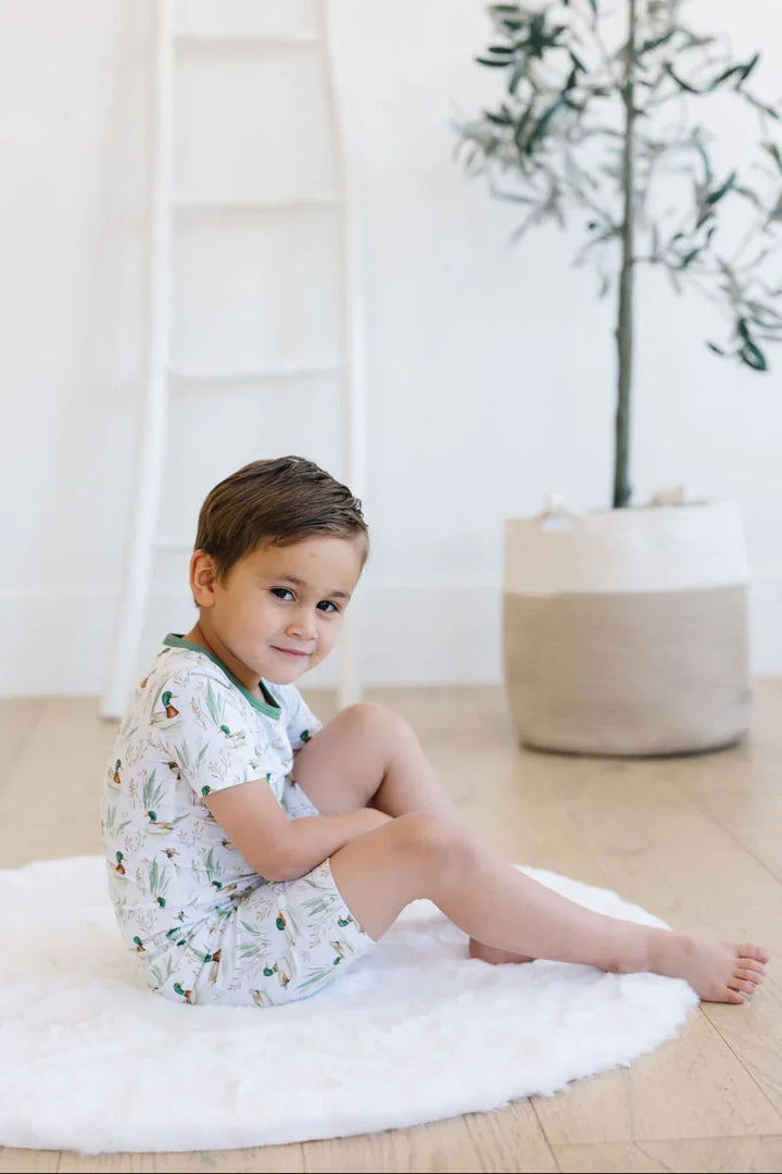 Toddler in mallard duck matching bamboo pajamas, two-piece kids set.