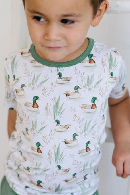 Close-up of mallard duck print on bamboo kids graphic T-shirt, showcasing green duck and soft fabric texture.
