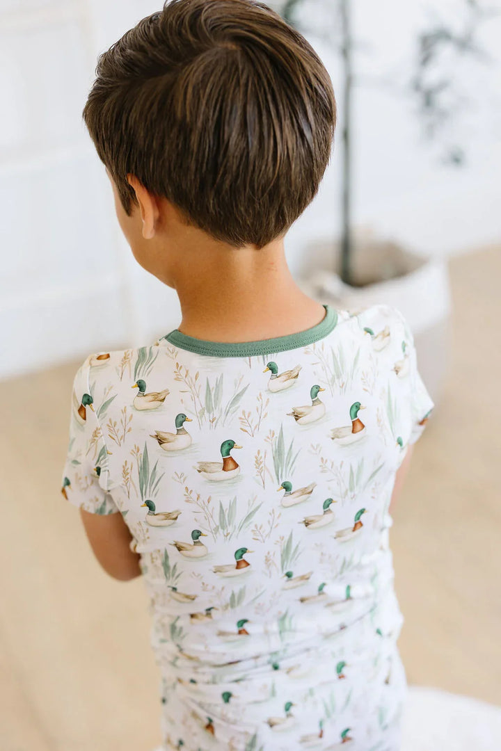 Back view of mallard duck bamboo pajama set with short sleeve top and long pants, unisex design for kids.