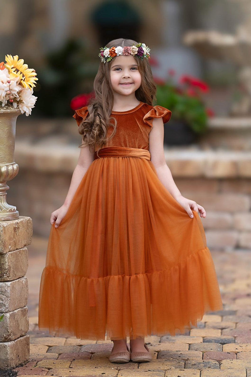 Marcella burnt orange velvet flower girl dress with ruffle sleeves and soft tulle skirt, front view with floral crown
