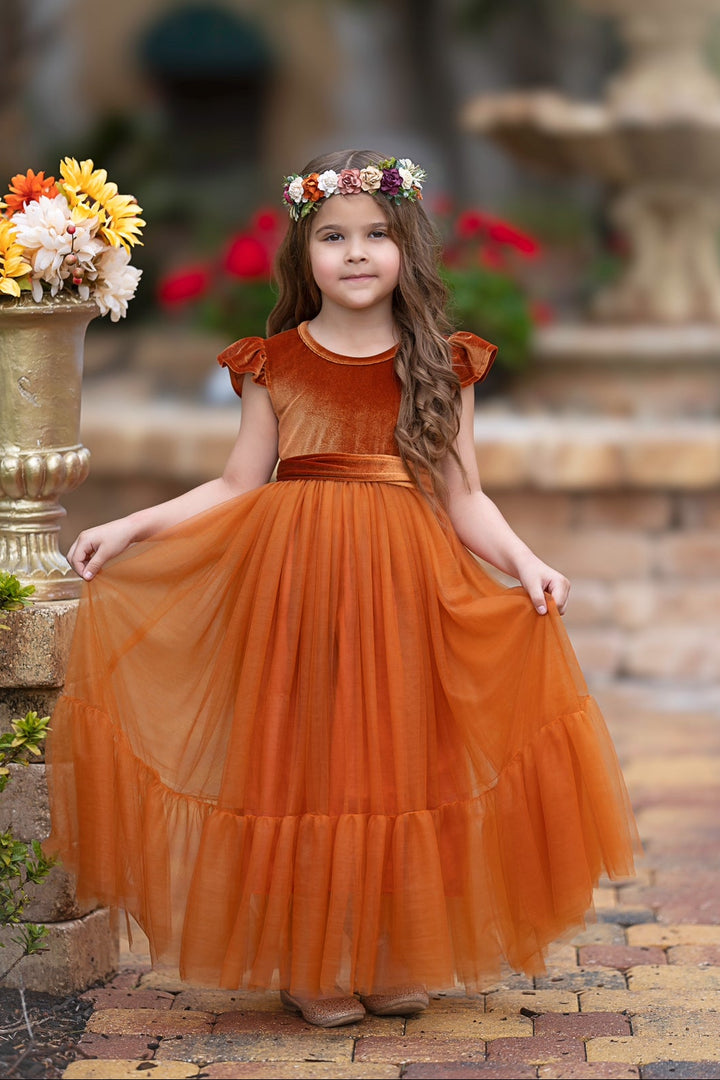 Marcella burnt orange velvet and tulle flower girl dress showing full skirt volume and warm fall wedding color