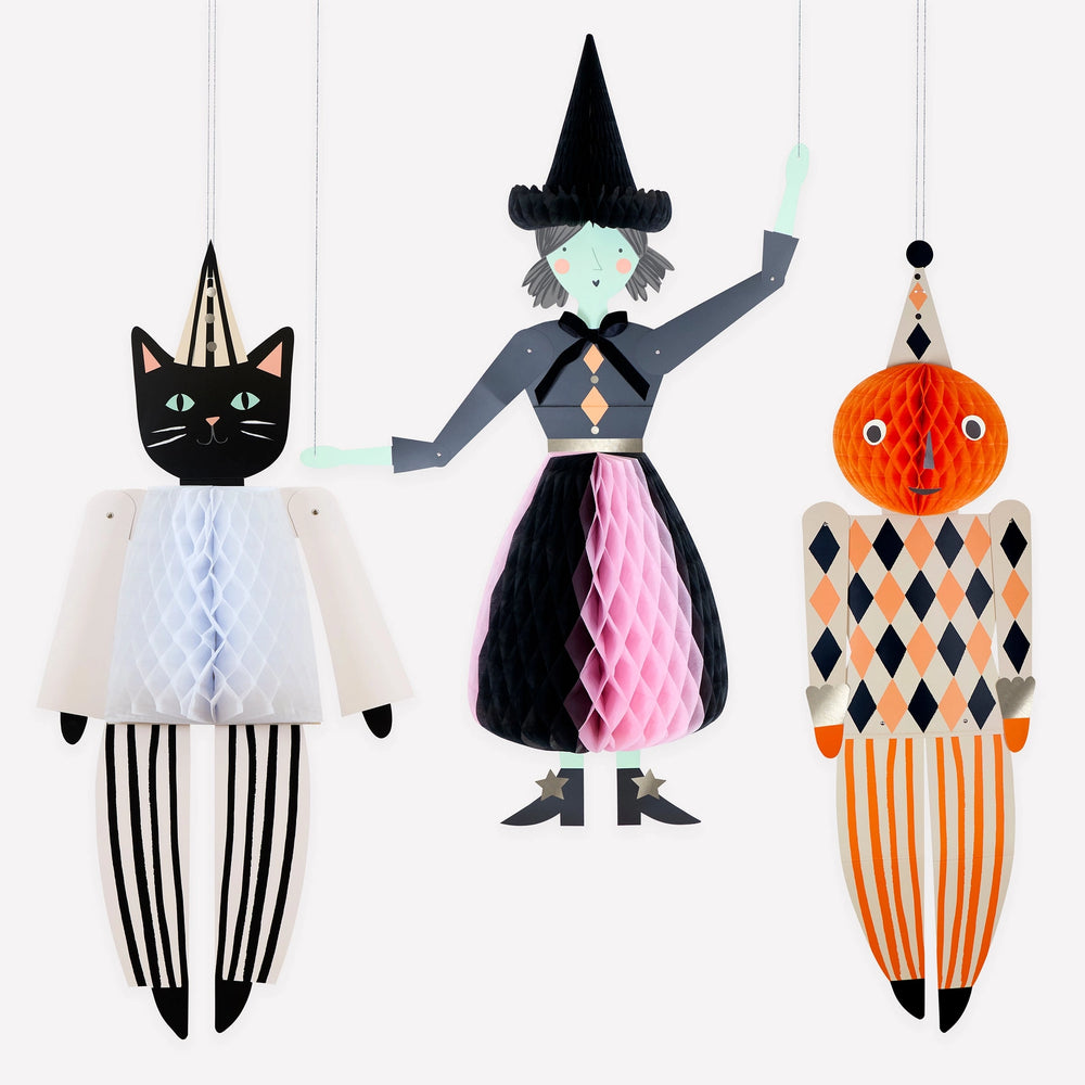 Giant Meri Meri Halloween witch, pumpkin and black cat decorations displayed with pumpkins