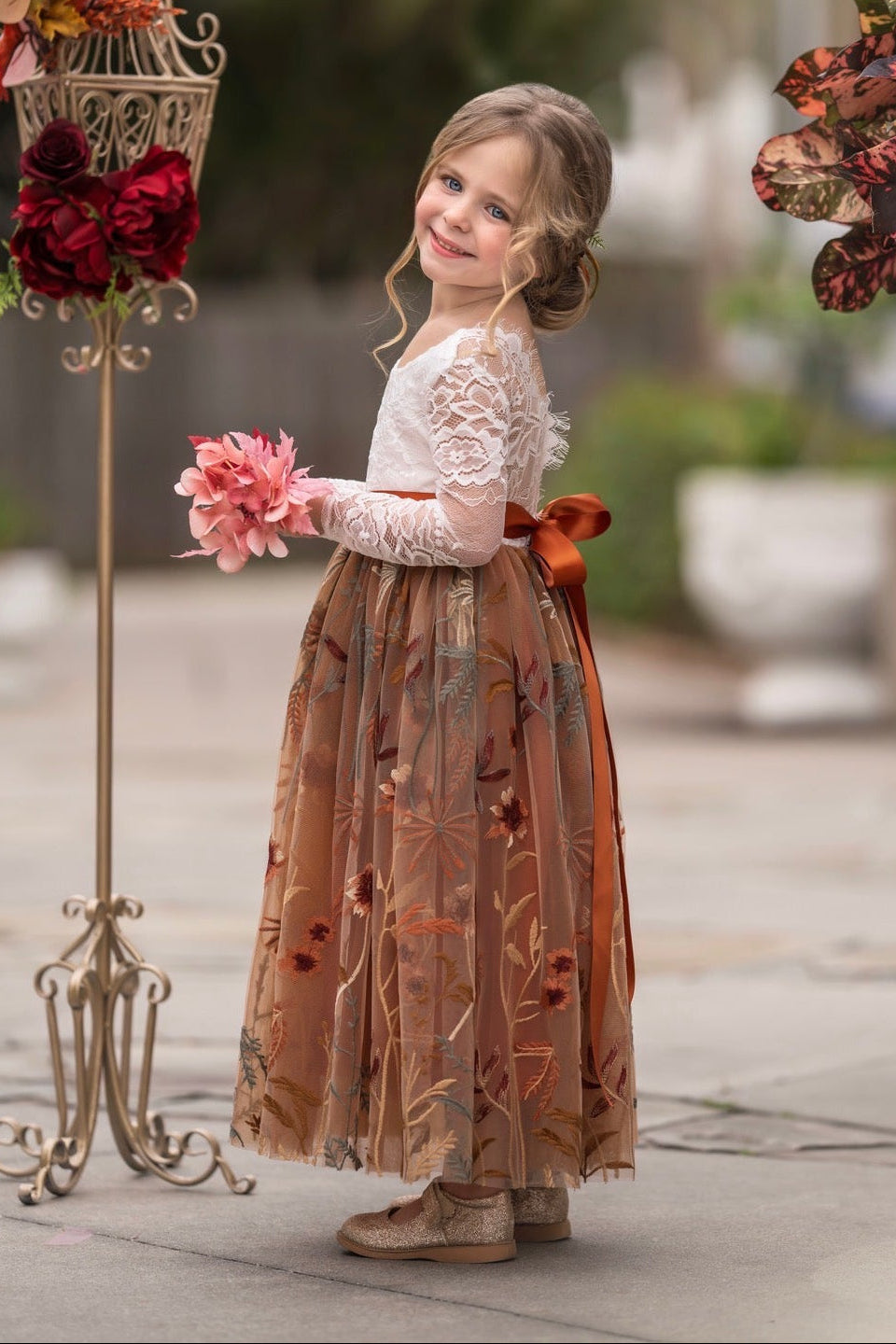 warm rust colored flower girl gown velvet sash