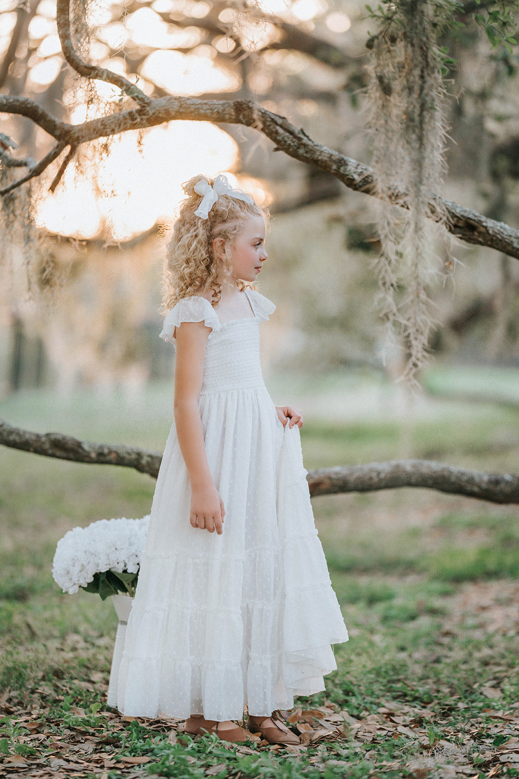 Full-length view of the Orange Blossom Orchard Collection dress with heirloom-inspired tiers and flutter sleeves.