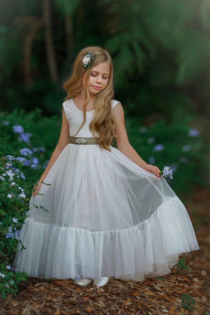 Classic soft white flower girl dress with plain tulle skirt and lace bodice in natural light