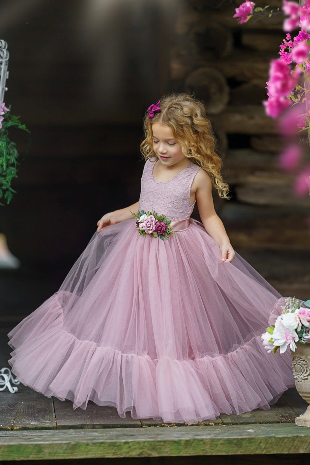 Mauve sleeveless lace flower girl gown styled for romantic wedding portraits