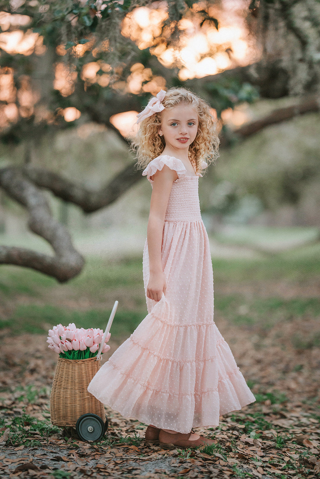 Little girl in pink swiss dot mother daughter matching maxi dress