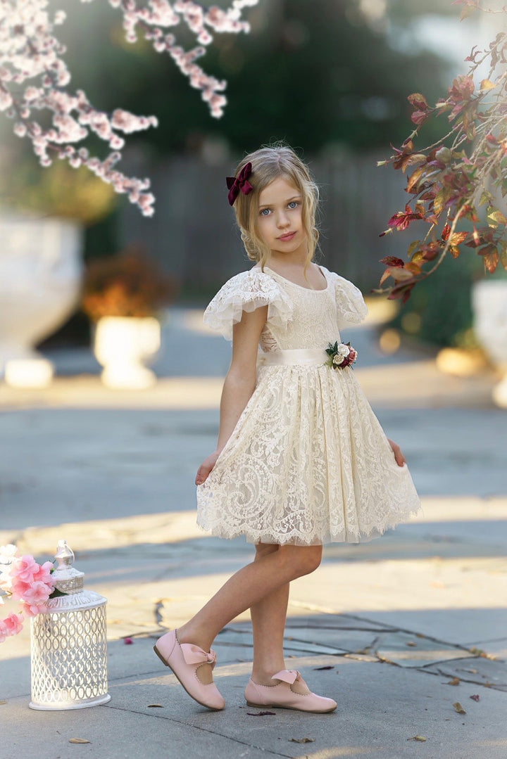 Antique ivory lace flower girl dress with romantic ruffle sleeves and classic knee-length silhouette, Elowen dress for a flower girl.