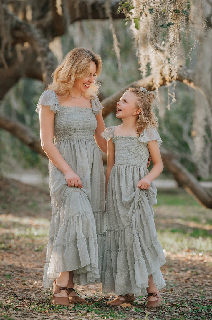 Matching Bay Leaf Orchard Collection dresses for women and girls photographed beneath oak trees.