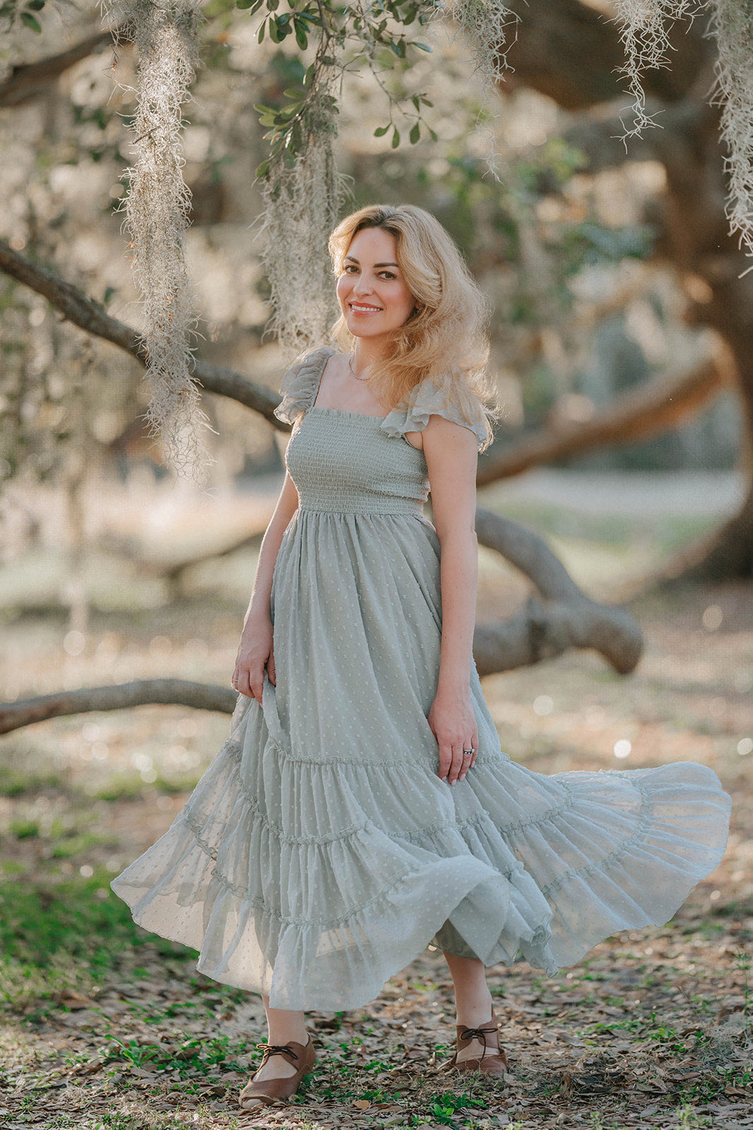 Full-length view of the Bay Leaf Swiss dot maxi dress featuring a smocked bodice and flowing tiered skirt.